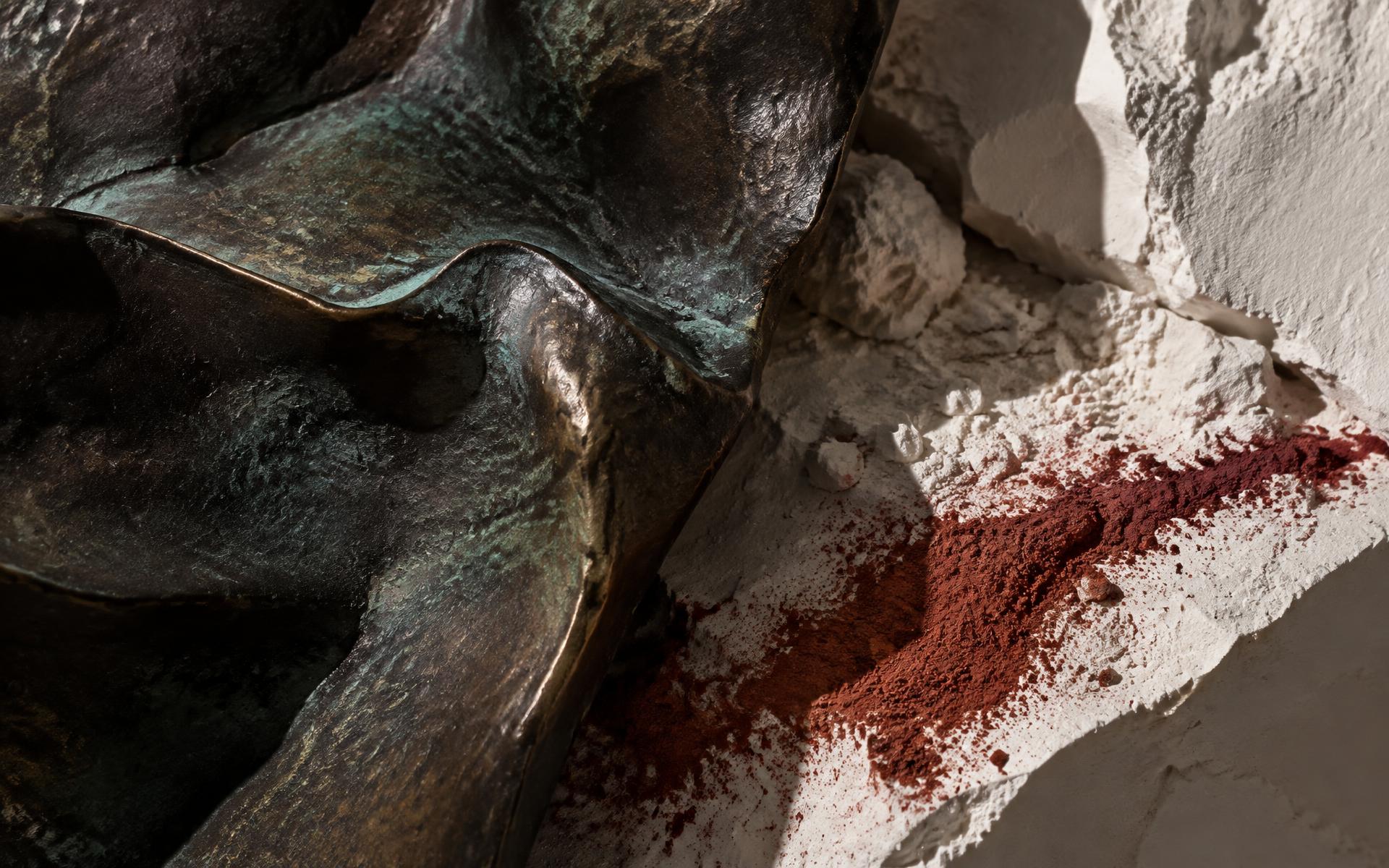 Bronze patina, plaster and oxide pigment photographed as a material study